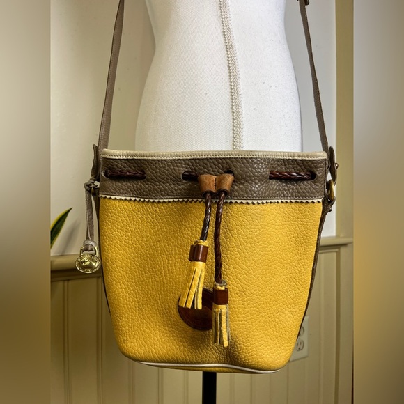 Dooney & Bourke Handbags - Vtg Dooney & Bourke AWL Teton Drawstring Crossbody Bucket Bag Palomino Yellow